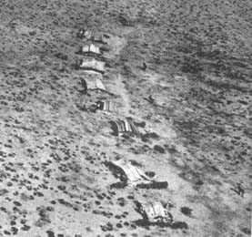 Aerial view of a Bedouin encampment in the Libyan Desert, on deforested land ruined by agricultural production during the Roman era.